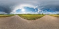 Full spherical seamless panorama 360 degrees angle view on no traffic asphalt road among alley and fields with awesome clouds in