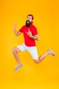 Full of strength and energy. Hipster dancing jumping. Feeling free. Running man yellow background. feel himself Royalty Free Stock Photo