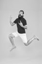 Full of strength and energy. Hipster dancing jumping. Feeling free. Running man yellow background. feel himself Royalty Free Stock Photo