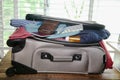 Full suitcase packed for vacation without more space