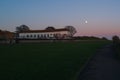 The almost full super `snow` moon rising over the boating lake building on the promenade of Ramsgate west cliff