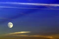 Full supermoon in dramatic blue sky and clouds