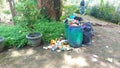 full trash cans and messy trash Royalty Free Stock Photo