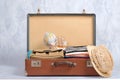 Full travel suitcase on grey background, opened case with travel clothing, accessories. Banner mockup with copy space. Travel or t Royalty Free Stock Photo