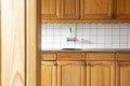 Full view of a classic wooden and kitchen with white tiled wall, retro vintage design complete furniture. close-up Royalty Free Stock Photo