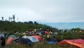 Full view of climbers& x27; tents from the top of Mount Talang, Indonesia