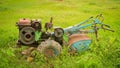 Full view of an old farm tractor plow and tire stock. Old farm tractor plow Royalty Free Stock Photo