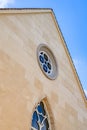 Full view and partial close-up of European-style steeple church, Gothic architecture