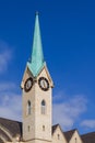 Full view and partial close-up of European-style steeple church, Gothic architecture