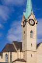 Full view and partial close-up of European-style steeple church, Gothic architecture