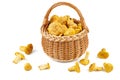 Full wicker basket with fresh chanterelle mushrooms isolated on white Royalty Free Stock Photo