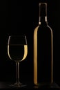 Full wine glass of white wine with bottle Royalty Free Stock Photo