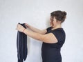 Full woman fatty tries on too small shape pants lose diet measurement Royalty Free Stock Photo