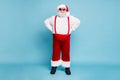Fulle length photo of funny funky fat overweight grey-haired santa claus with hat modern spectacles enjoy christmas time