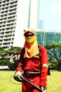 Fully covered mowing worker in singapore Royalty Free Stock Photo