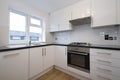 Fully fitted modern kitchen in white Royalty Free Stock Photo