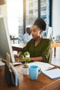 Fully focused on the task in front of her. a businesswoman working on her computer in the office. Royalty Free Stock Photo