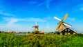 Fully operational historic Dutch Windmills along the Zaan River Royalty Free Stock Photo