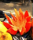 Fully ripe and healthy Papaya cut in a flower shape for sale in fruit market