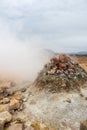 Fumarole evacuating pressurized hot sulfurous gases from volcanic activity in the geothermal area of Hverir Iceland near