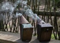 Beekeeper inverter close-up. Chimney in the apiary and hive