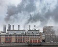 Fuming smokestacks of a factory. Environmental pollution