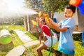 Boy with strong face expression in water gun fight Royalty Free Stock Photo