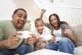 Fun African American Family Playing Video Games