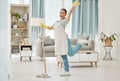 Fun asian woman, mop or cleaning living room with housekeeping floor product for home cleaner service, maid or worker Royalty Free Stock Photo