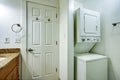 Fun bathroom with bathroom vanity and stacked washer and dryer