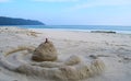 Fun at Beach - Sand Castle with Blue Ocean and Sky in Background - Leisure, Play and Activity Royalty Free Stock Photo