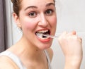 Fun beautiful girl brushing her teeth for healthy dental care Royalty Free Stock Photo