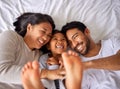 Fun, bed and happy family playing, wake up and happy from above, tickle and laughing in their home. Bedroom, games and Royalty Free Stock Photo