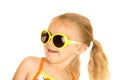 Fun blond girl leaning back wearing sunglasses portrait
