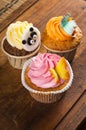 Fun cakes on wood background Royalty Free Stock Photo