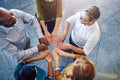 Fun, collaboration and teamwork in hands linking during team building by diverse group of business people. Above happy Royalty Free Stock Photo
