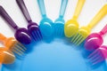 Fun colored background with plastic forks and spoons on the chil Royalty Free Stock Photo