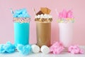 Cotton candy and smores summer milkshakes against a pastel pink background