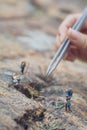 Fun concept of miniature hiker figure adventure in the rocks, making of the scenes