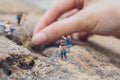 Fun concept of miniature hiker figure adventure in the rocks, making of the scenes