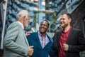 Fun conversation. Three business men talking. Royalty Free Stock Photo