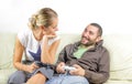 Fun couple look at each other - play video games Royalty Free Stock Photo