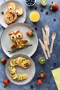 Fun critter shaped Keto diet pancakes served with fruit and juice.