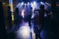 Fun dance party at nightclub after wedding reception, guests and friends dancing on the floor night with lights, disco concept Royalty Free Stock Photo