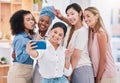 Fun, diverse and playful team selfie on phone and having fun, goofing around or making peace sign gesture. Cheerful Royalty Free Stock Photo