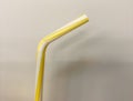 Drinking straw yellow tube isolated on white background Royalty Free Stock Photo