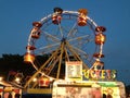 fun fair big wheel ride with ticket booth Royalty Free Stock Photo