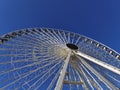 Fun fair in the city with a big ferris wheel Royalty Free Stock Photo