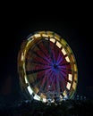 Fun fair Giant Colorful Ferris wheel spinning at night Royalty Free Stock Photo
