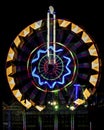 Fun fair Giant Colorful Ferris wheel spinning at night Royalty Free Stock Photo